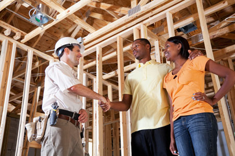 A Couple Shaking Hands with Their Affordable Home Builder