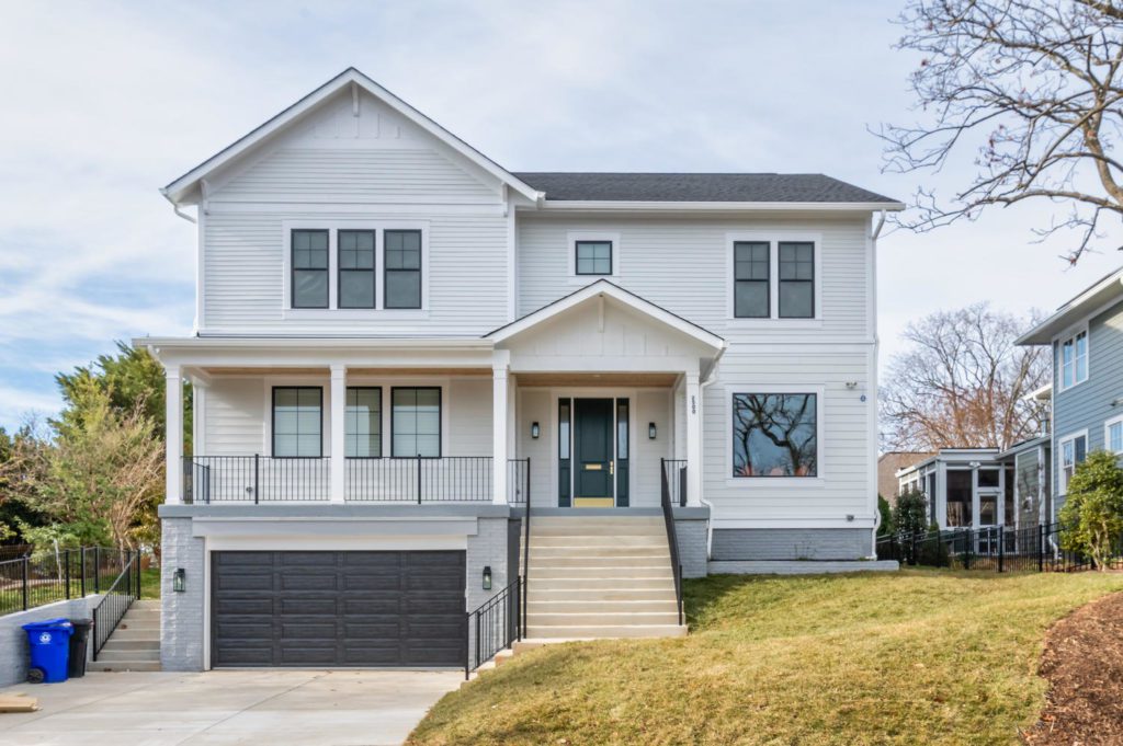 An example of a transitional home with white, gray, & black finishes.