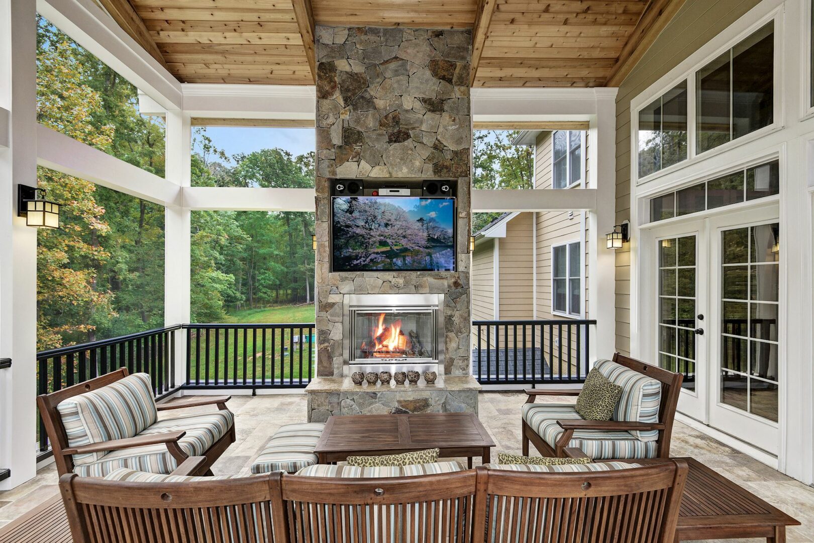 Interior of home addition with outdoor seating and fireplace