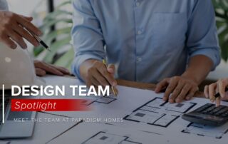 Custom home design team looking at floorplans