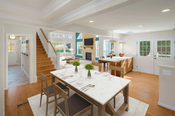 View from an open kitchen into a bright living room in remodeled home