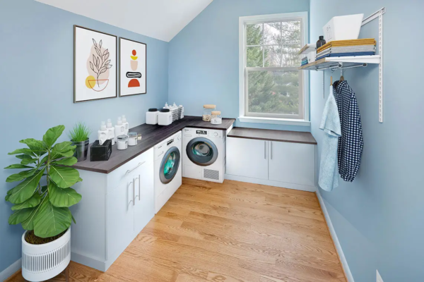 Laundry room with light blue walls
