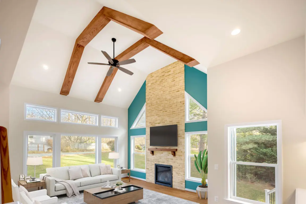 Open living room of remodeled home with high ceilings and bright natural light