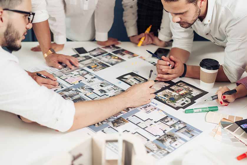 Group-of-people-looking-at-design-build-plans