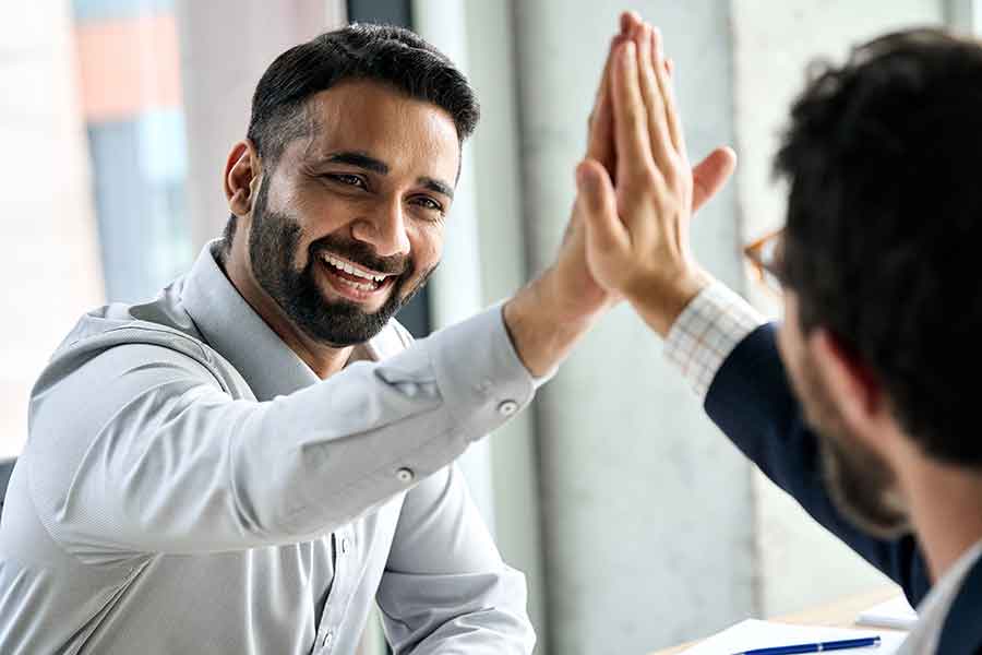 2 people giving a high five