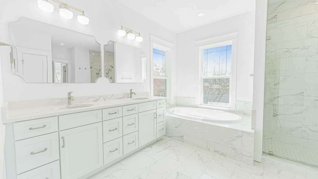 Open, Spacious Bathroom Remodeling Layout with White Marble Tile.