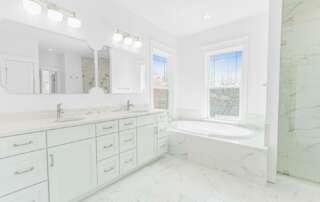 Open, Spacious Bathroom Remodeling Layout with White Marble Tile.