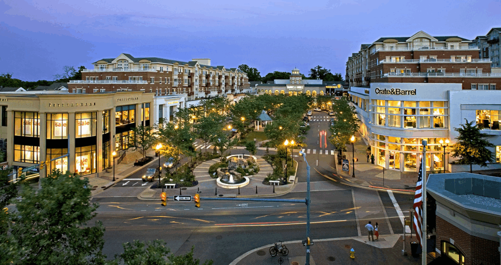 Scenic twilight view of Arlington, Virginia featuring modern buildings and city lights, representing the vibrant urban setting of the area.